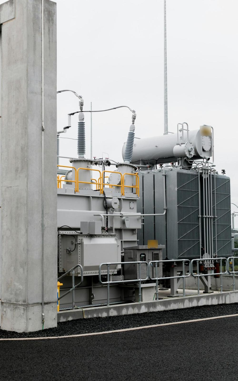 Power transformer with radiators, conservator and frame