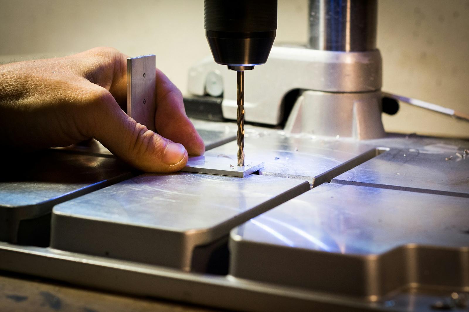 Drilling a steel plate on a drill press